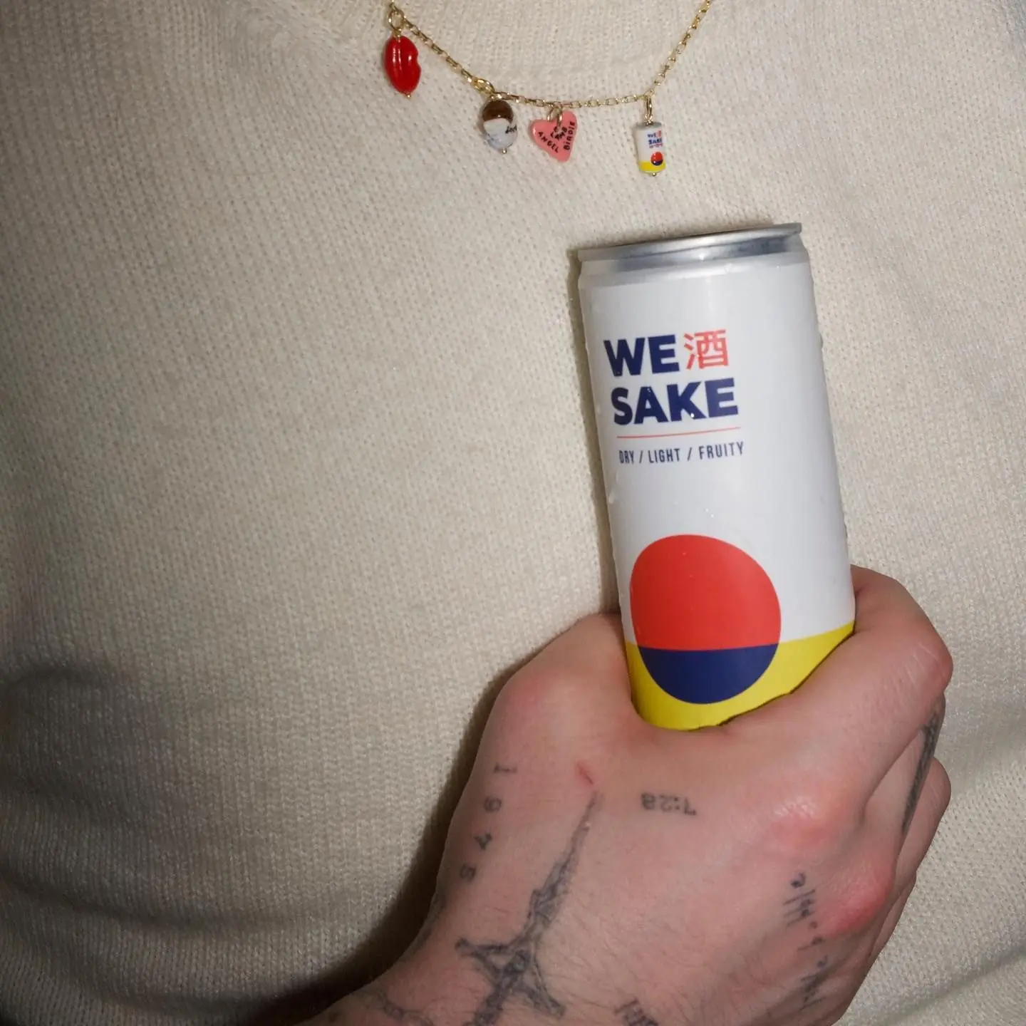 A hand holding a WESAKE can
