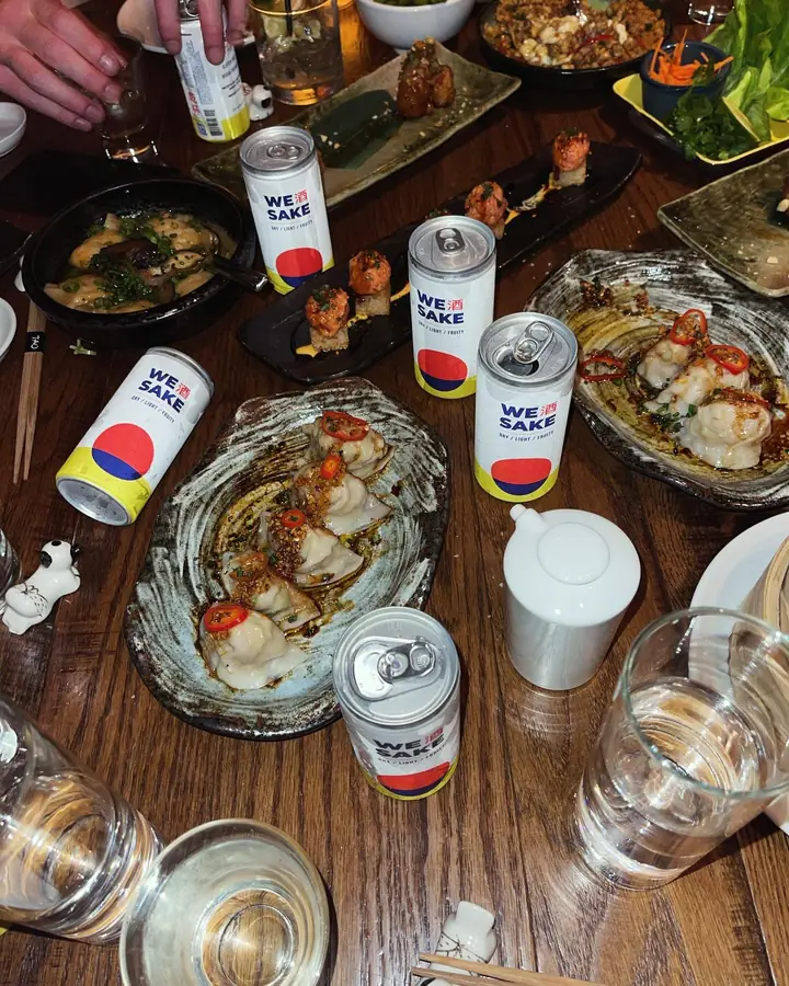 WESAKE cans on a table full of small plates