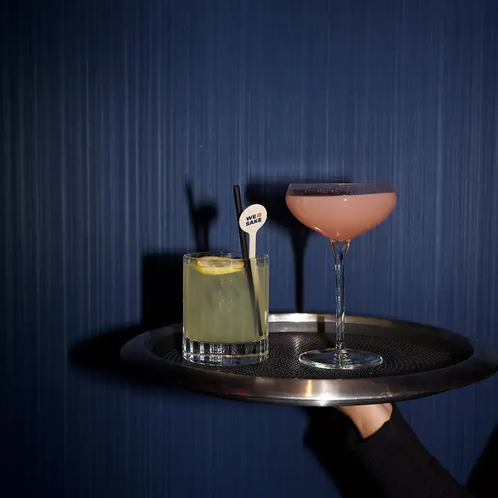 A sake cocktail and a highball on a tray